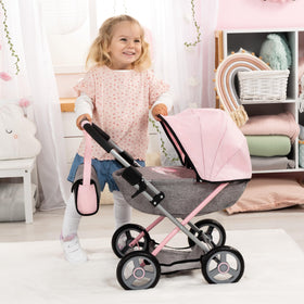 Cozy blanket and pillow accompany Bayer stroller for comforting pretend care.
