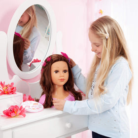 Charlene styling head makeup palette demonstrates makeup practice and imaginative beauty routines.