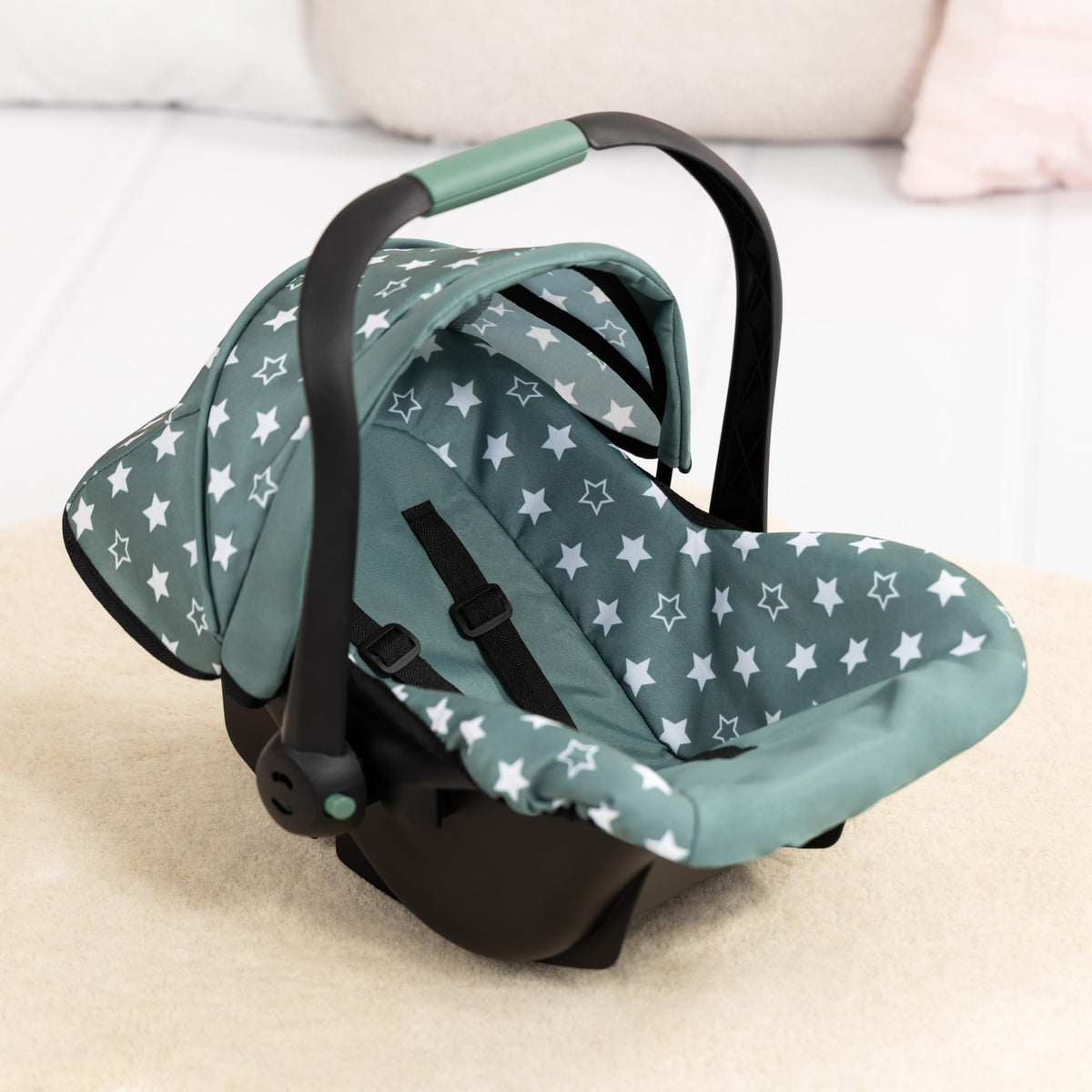 Bayer Design Deluxe Car Seat rocker feature soothing a toy on a flat surface.