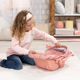 Bayer Design Deluxe Doll Car Seat rocks smoothly on flat surfaces for soothing play sessions.