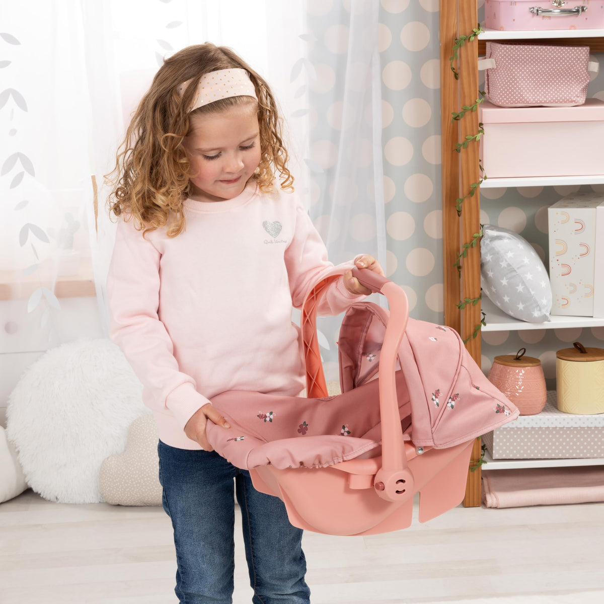 Bayer Design Deluxe Doll Car Seat sun canopy shields from wind during playtime.