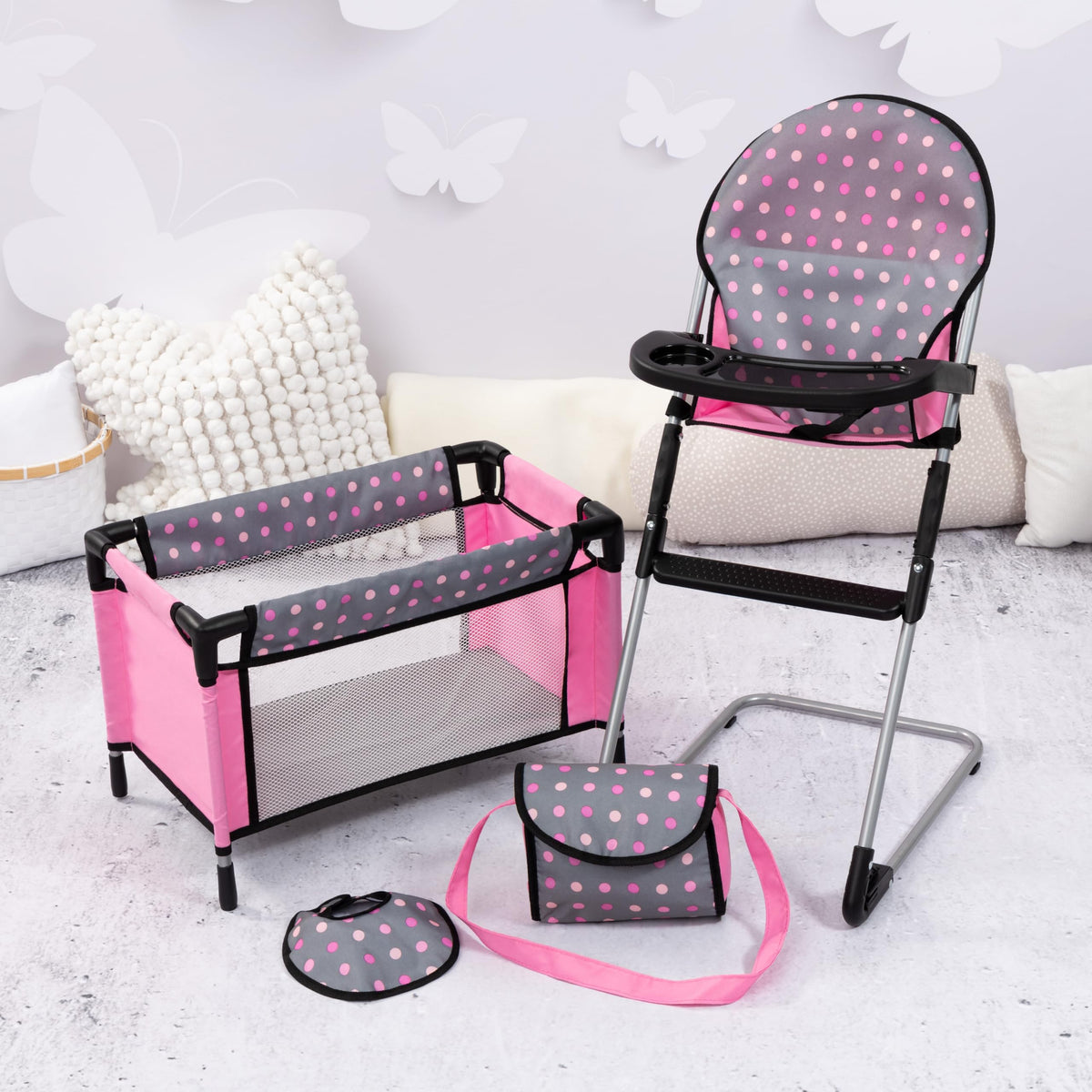 Bayer Doll Bib in grey pink dots supports tidy feeding