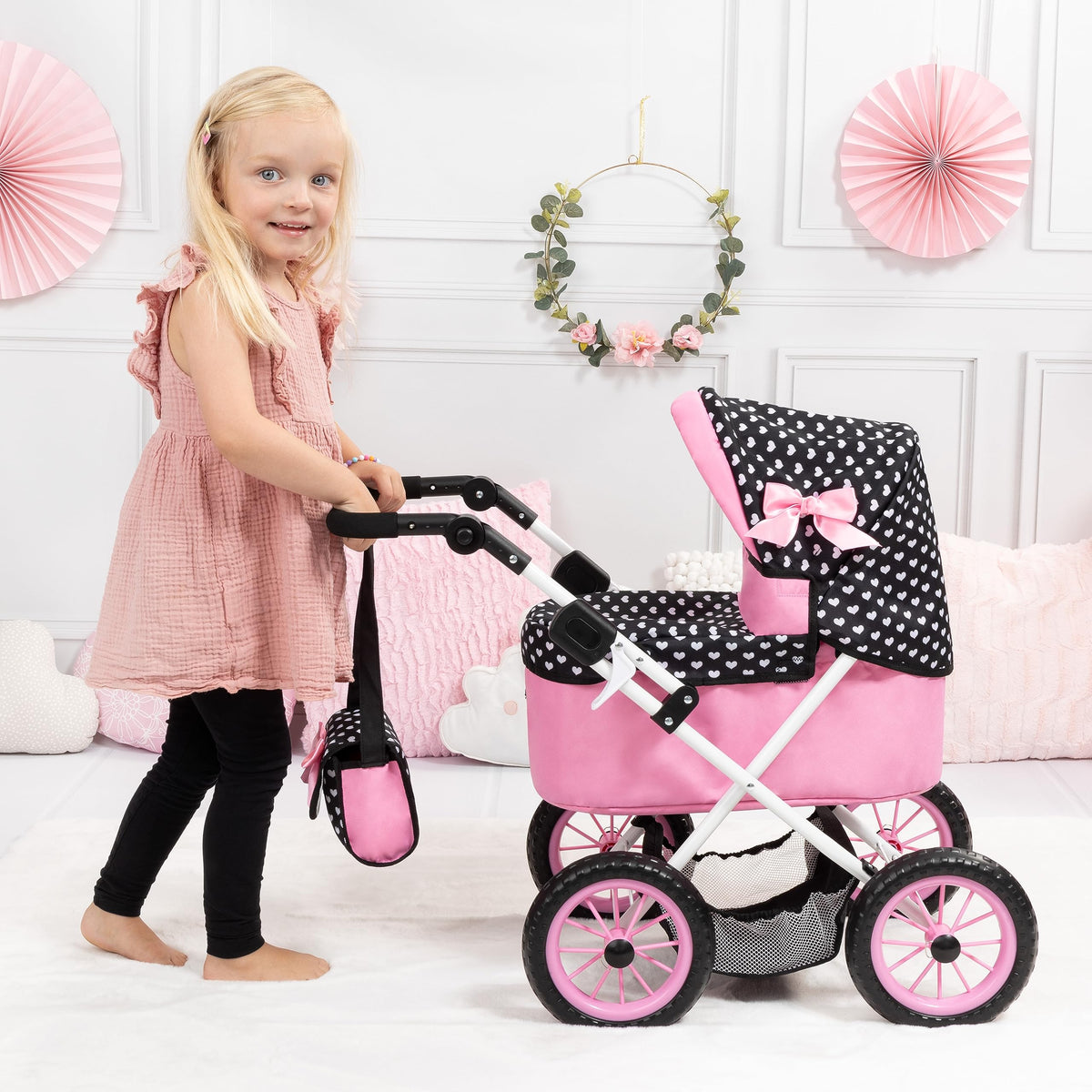 Bayer stroller undercarriage storage basket, convenient for accessories during pretend play.
