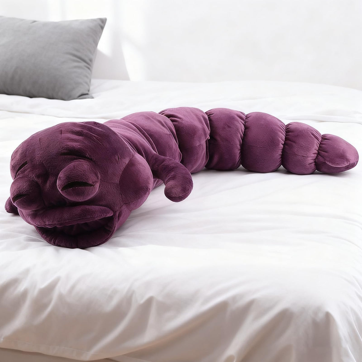 Beego Jujutsu Toji Caterpillar plush on desk scene with gaming setup