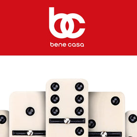 Shelf-ready Bene Casa Cuban flag dominoes beside decor or game night corner
