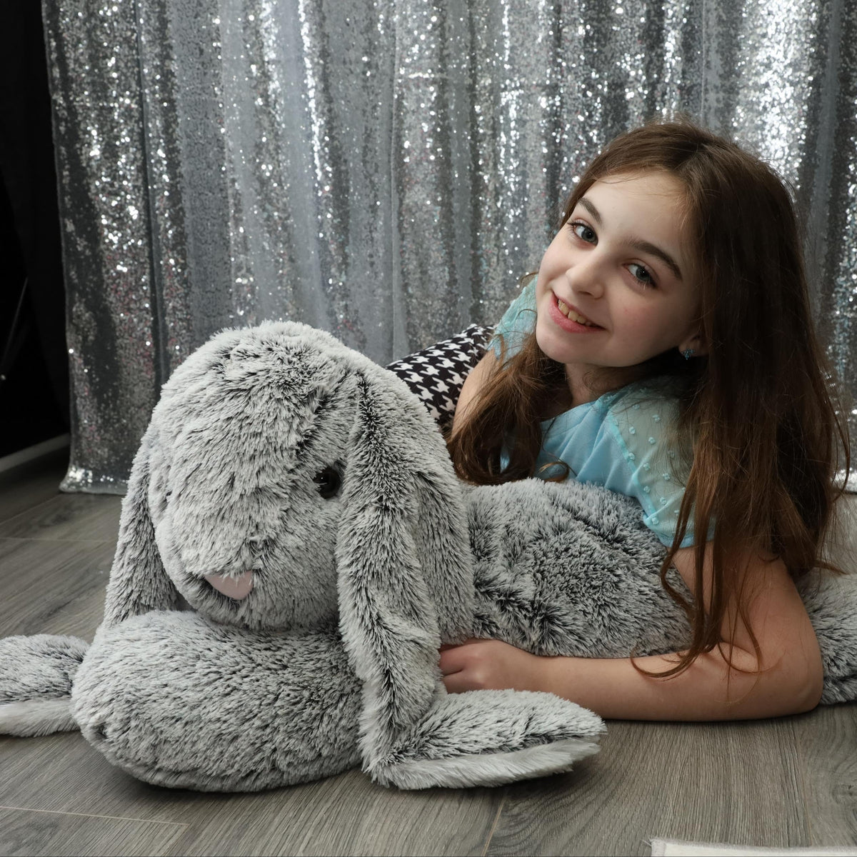 BENINY bunny fluffy tail detail enhances cute toy appeal.