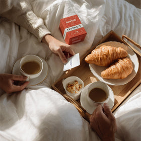 BestSelf Co. Intimacy Deck cards laid out on a table for a date night.