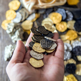 Beverly Oaks pirate coins silver doubloon front view emphasizing dense metal feel and durability.