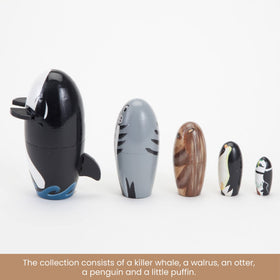 Bits and Pieces penguin nesting doll, sleek contrast invites touch and imagination.