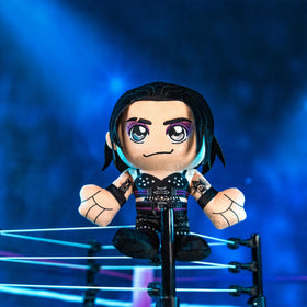 Rhea Ripley Kuricha plush, textured fabric close-up highlights durable stitching.