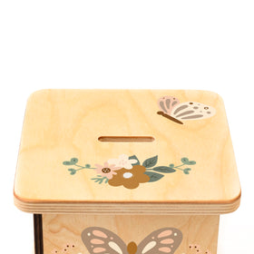 BloomOwl butterfly piggy bank in nursery decor demonstrates friendly saving charm.