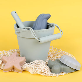 BLUE GINKGO dolphin mold creates playful sand shapes at the beach.