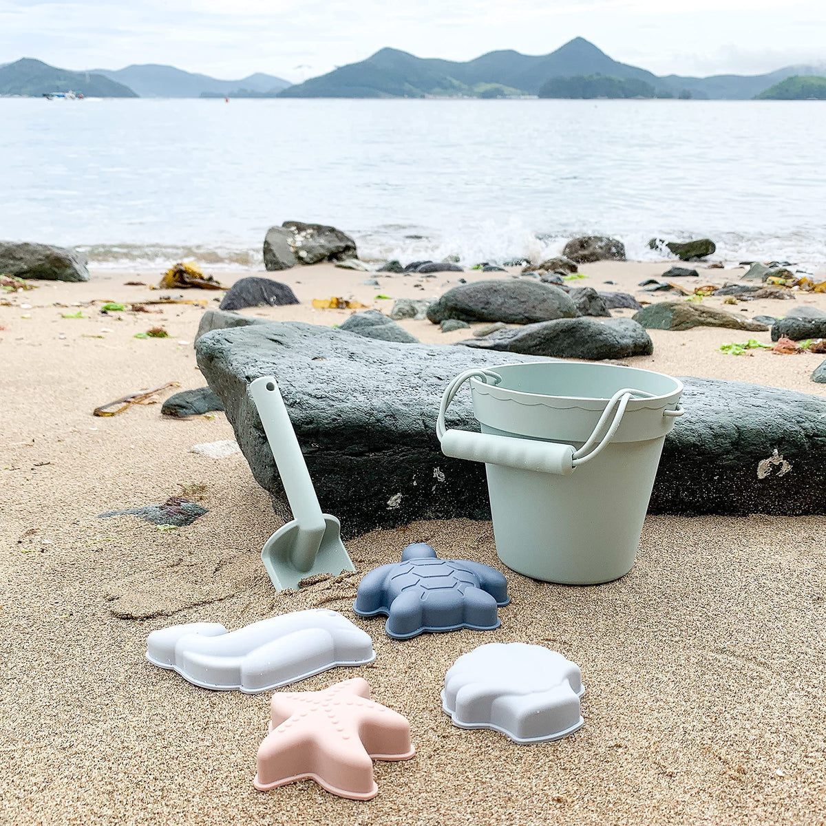 BLUE GINKGO silicone beach toys in green, modern, kid-friendly design.