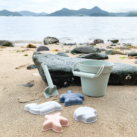 BLUE GINKGO silicone beach toys in green, modern, kid-friendly design.