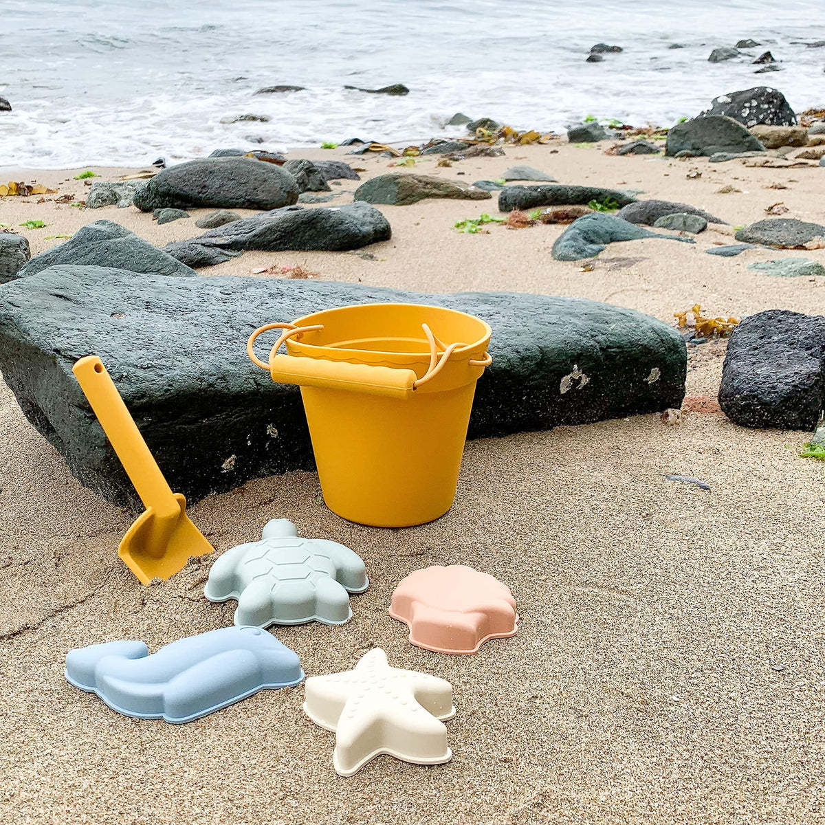 BLUE GINKGO beach toys on sand invite imaginative play