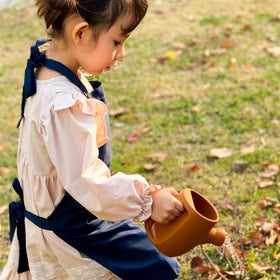 BLUE GINKGO small shovel shown in silicone, comfortable for tiny hands.