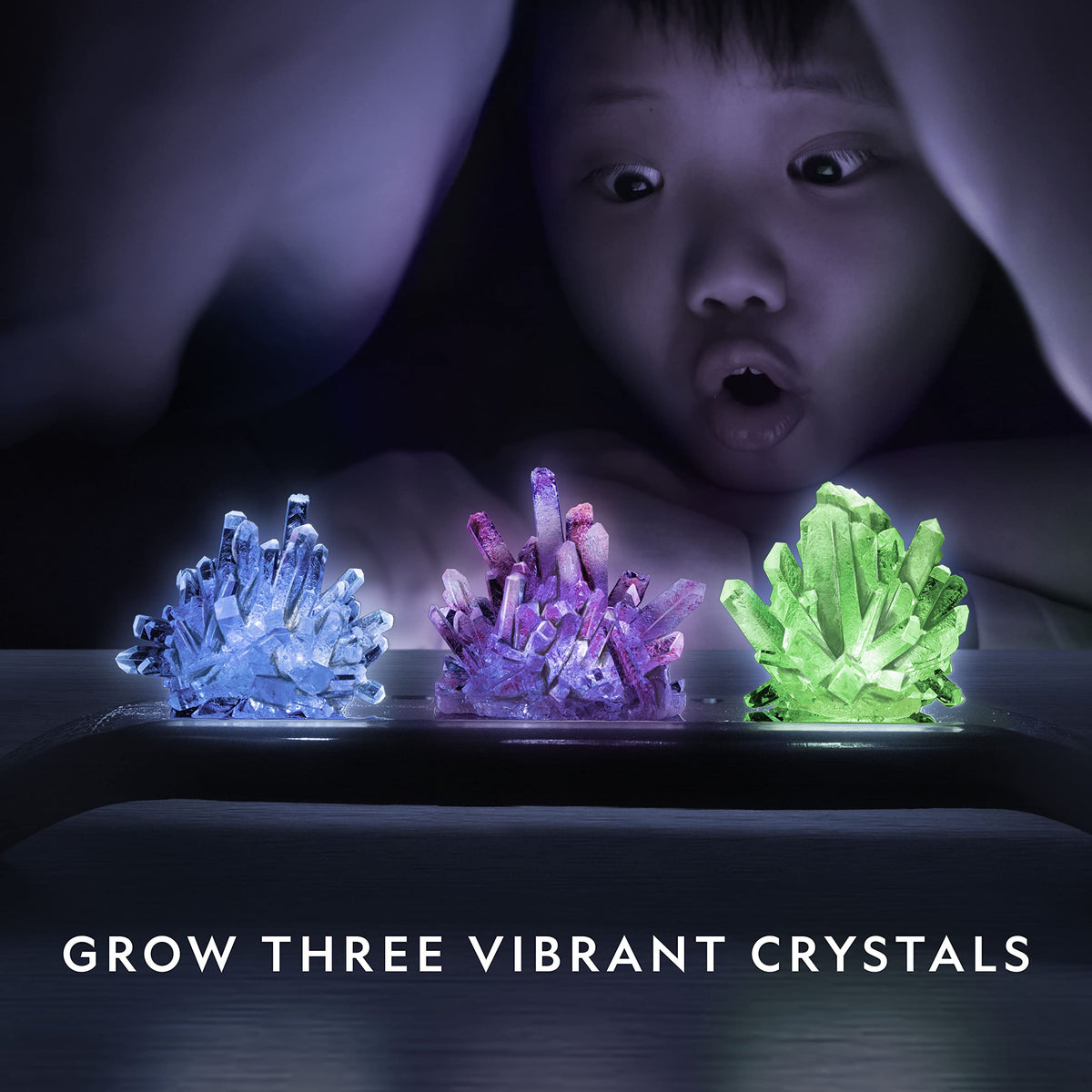 Three colored crystals forming blue, purple, and green hues.