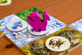 Blue Orange Dragomino egg tokens on board highlighting scoring opportunities for players.