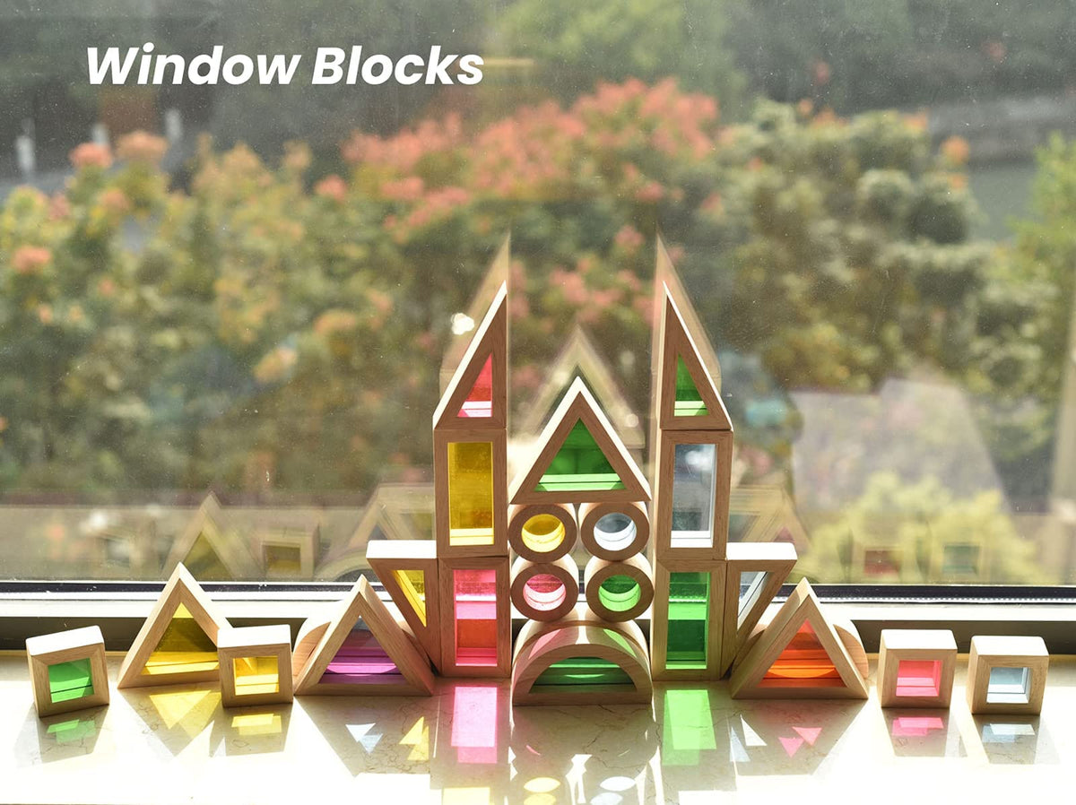 BOHS rainbow blocks aiding motor skills as kids handle circles and squares