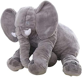 Bedroom decor featuring BOOJALOO elephant plush as a comforting accent.