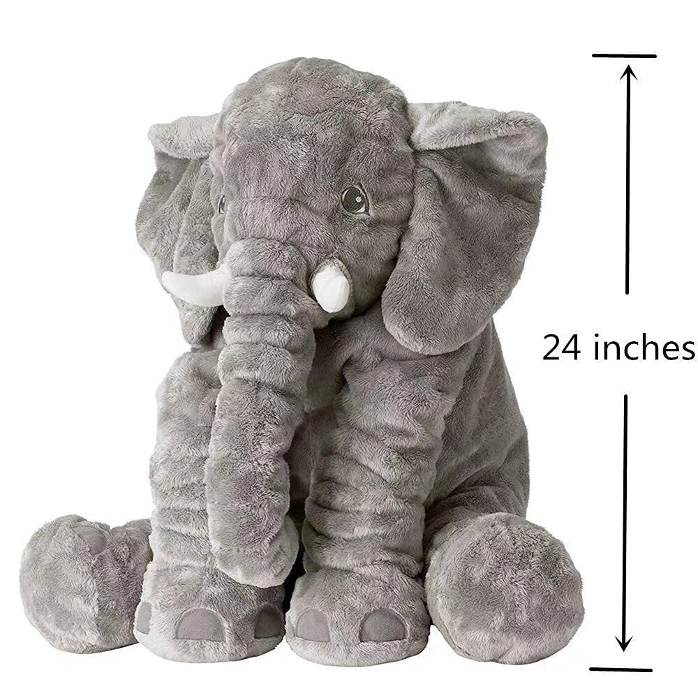 Child cuddles 24-inch BOOJALOO elephant plush at bedtime.