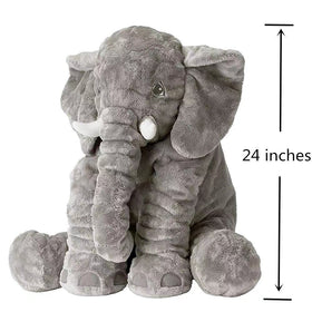 Child cuddles 24-inch BOOJALOO elephant plush at bedtime.