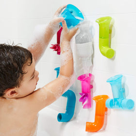 Toddlers enjoy motor-skill building through pour-and-rotate play in tub