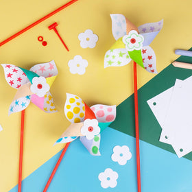 Colorful outdoor decor with Bosctanuc pinwheels for gardens and events.