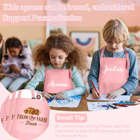 BOUBONI kids apron with two pockets keeps brushes and pencils handy.