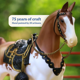 Breyer 75th Anniversary Western Horse side view highlights red dun pinto coat.