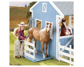 Breyer stable with open roof showcases loft access and realistic barn scenes