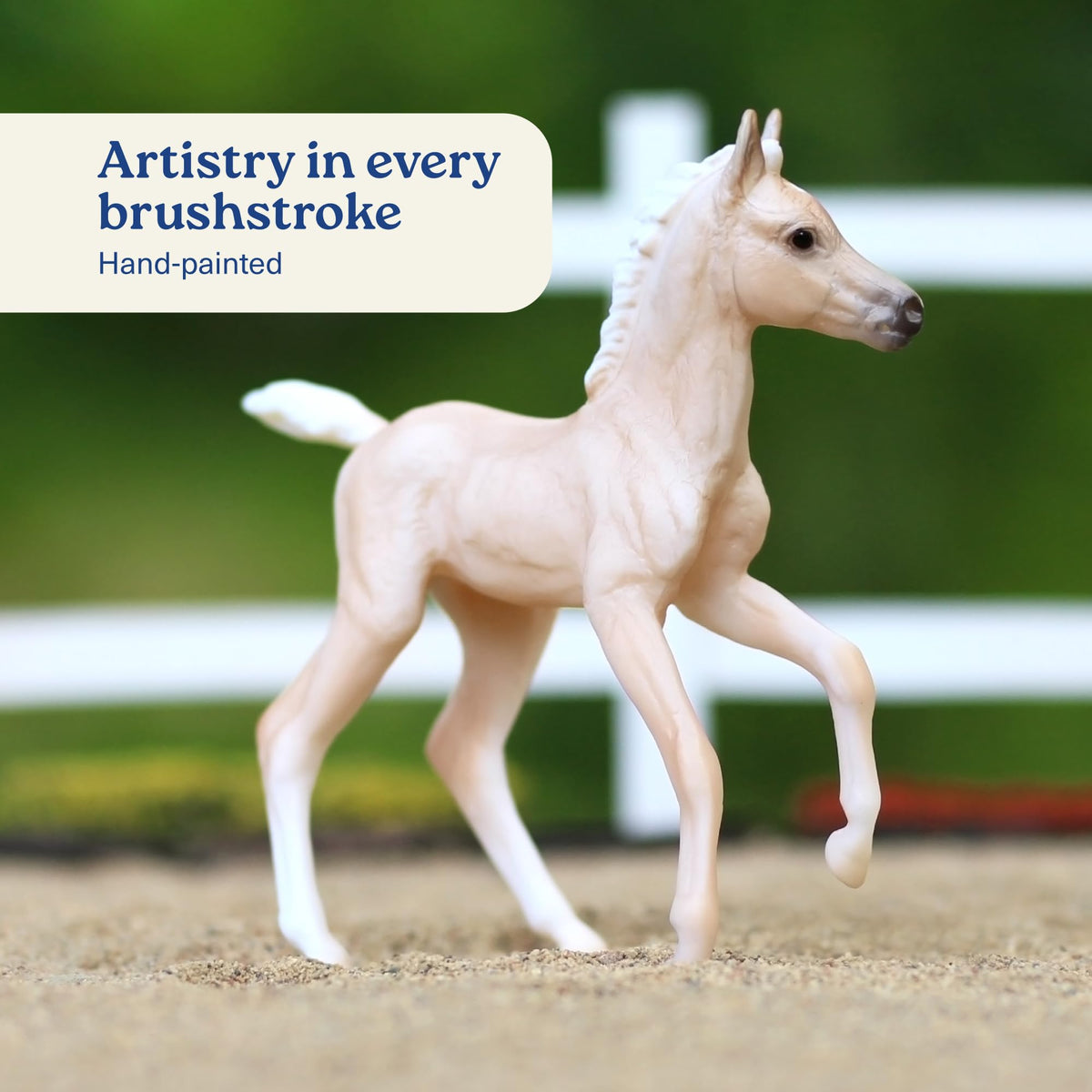 Breyer Palomino foal detail highlighting playful companionship on shelves.
