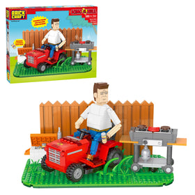 BrickCraft Hank Hill backyard scene featuring a lawn mower designed for desk display.