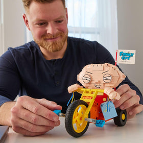 Brickcraft Stewie trike wheels and pedals move for interactive play.