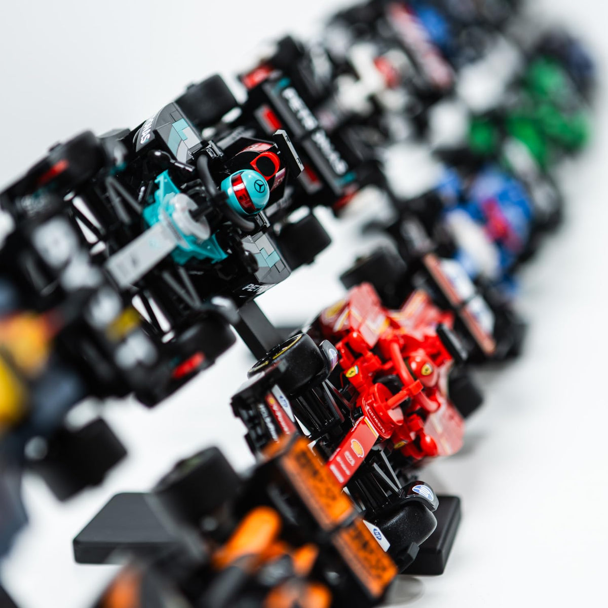 Brickify Speed Champions F1 stand with friction-fit clips securing two cars per level.
