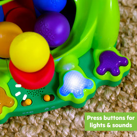 Bright Starts Poppin Ball Frog toy pressing feet activates lights and music