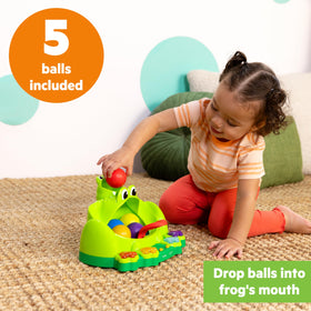 Bright Starts Poppin Ball Frog toy side ramp encourages tracking and reach