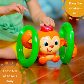 Bright Starts Roll & Glow Monkey rolling path showcases dynamic play.
