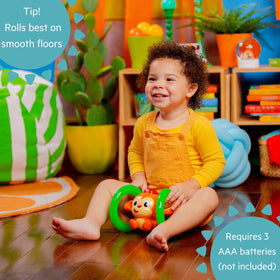 Bright Starts Roll & Glow Monkey tummy time companion encourages floor play.