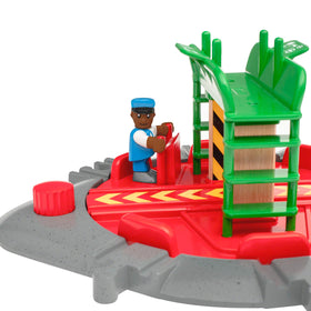 BRIO World engineer figure ready to operate the turntable during play.