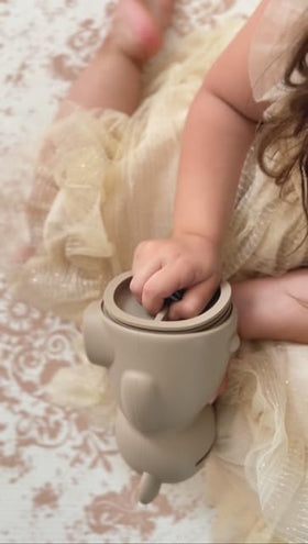 Brooklyn Neutral money bank on shelf in a cozy nursery setting