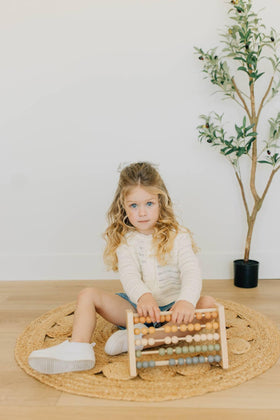 Brooklyn Neutral Montessori wooden toy offers independent learning through bead counting.