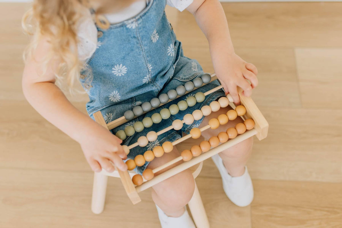 Brooklyn Neutral neutral boho nursery decor that doubles as a playful math activity.