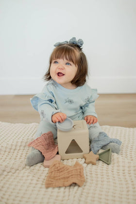 Brooklyn Neutral tissue box toy with organic cloths for sensory play