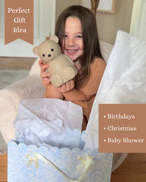 Brooklyn Neutral toddler-saving demonstration with coins encouraging early financial awareness