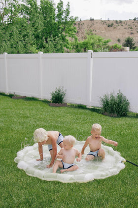 Brooklyn Neutral toddler splash pad in backyard invites safe, sunny play