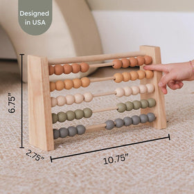 Brooklyn Neutral toddler stem toy encouraging fine motor skills during counting play.