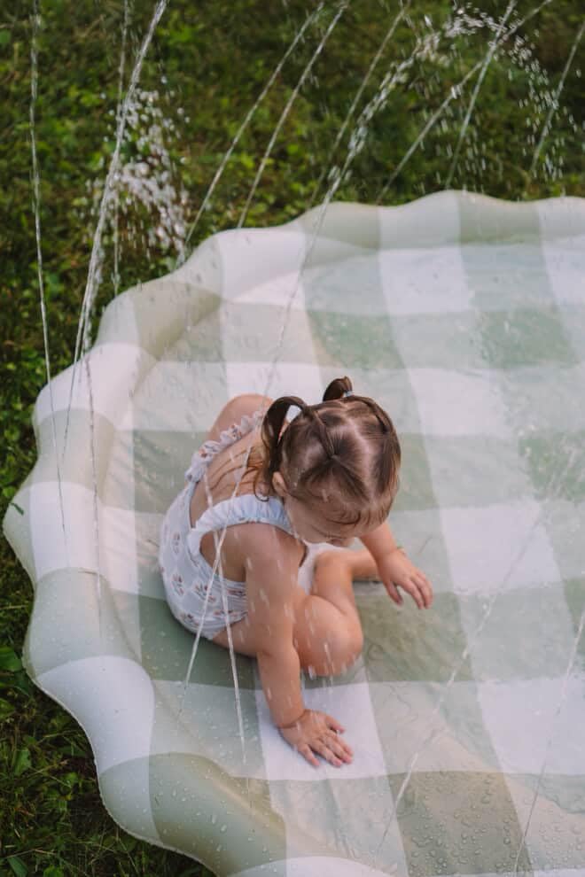 Brooklyn Neutral water mat splash pool creates simple backyard fun