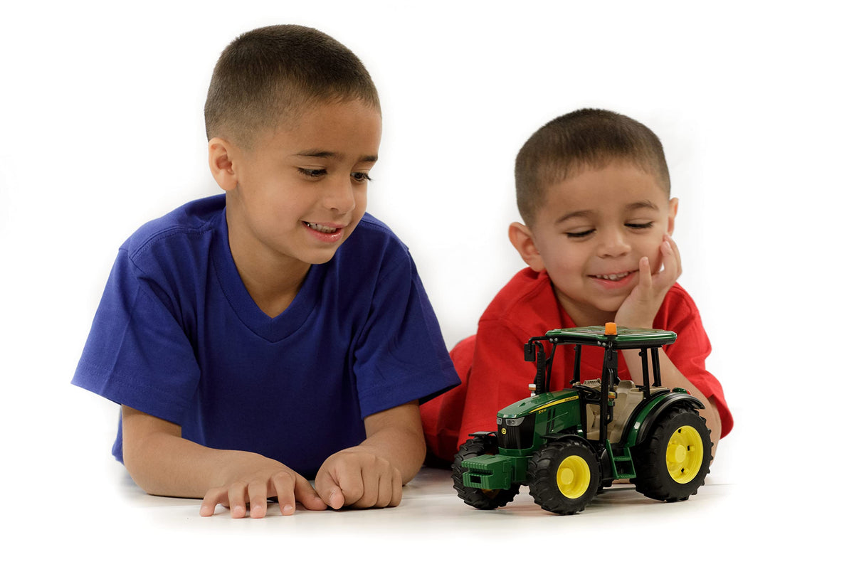 Optional slip-on front loader adds versatility to the Bruder 5115M tractor.