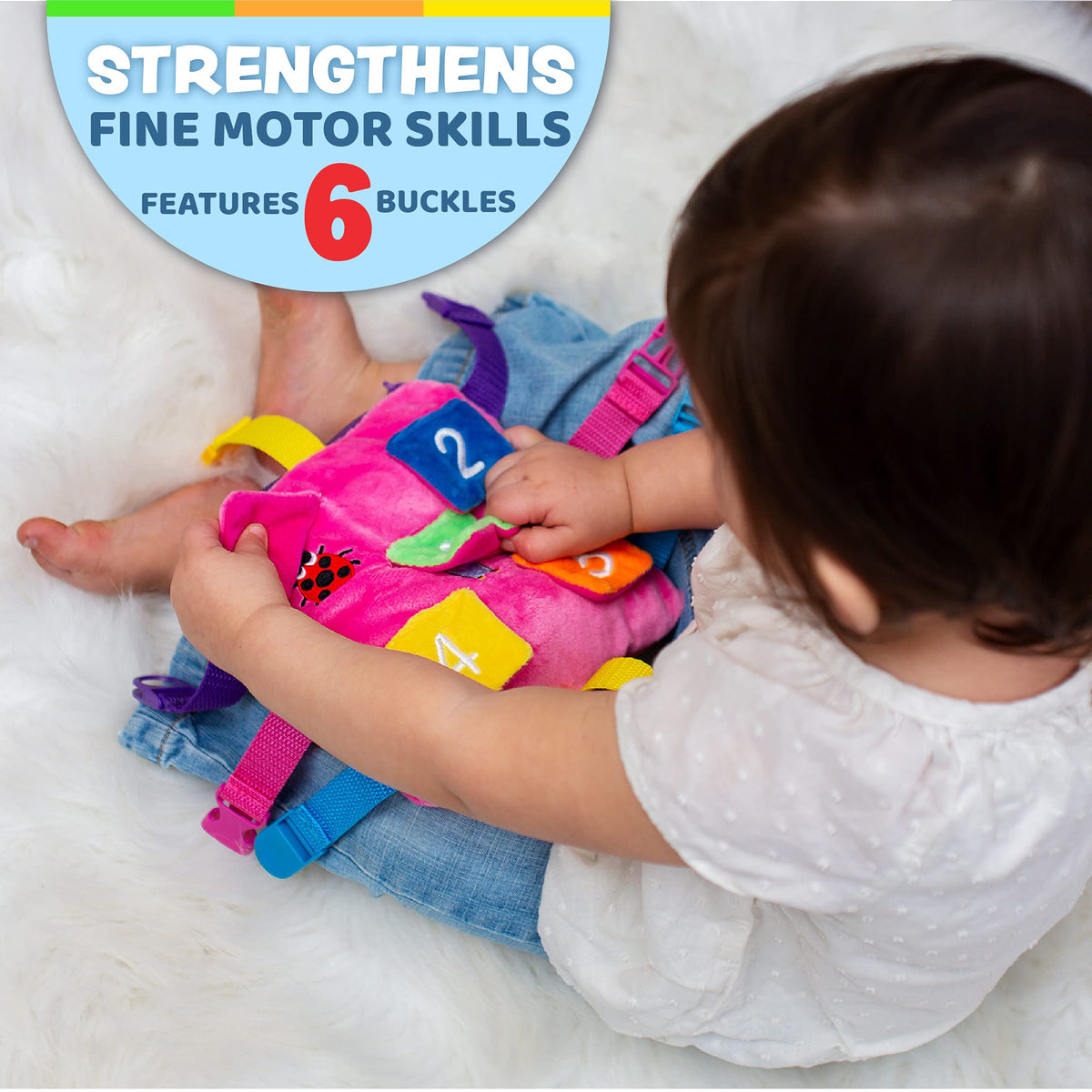 Buckle Toys Bella Square zipper pocket for storing small treasures during trips.